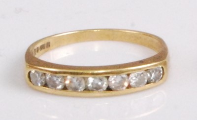 Lot 326 - An 18ct gold diamond half eternity ring,...