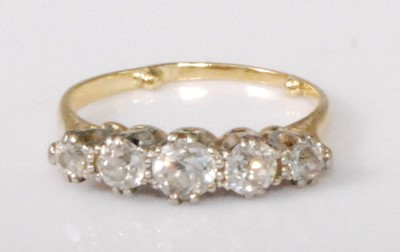 Lot 2178 - A yellow metal diamond five-stone ring, the...