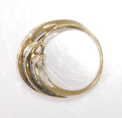 Lot 2179 - A contemporary 9ct gold diamond set dress ring,...