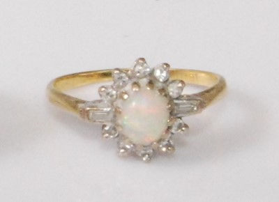Lot 2191 - An 18ct gold, opal and diamond dress ring, the...