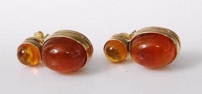 Lot 2224 - A pair of 14ct gold amber set ear studs, each...