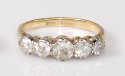 Lot 2237 - An 18ct gold and platinum diamond five stone...