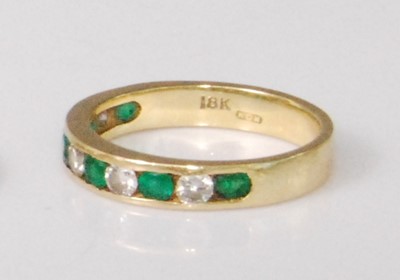 Lot 2238 - A contemporary 18ct gold, emerald and diamond...