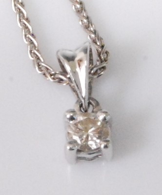 Lot 2241 - A platinum diamond set pendant, the four-claw...