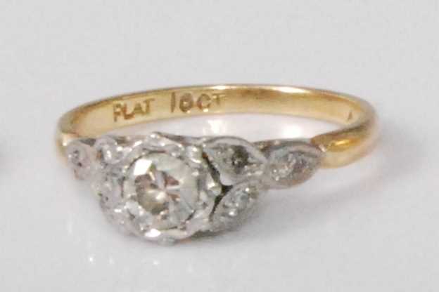 Lot 2243 - An 18ct gold and platinum diamond solitaire...