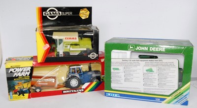 Lot 1273 - A collection of Ertl, Britains, and GAMA boxed...