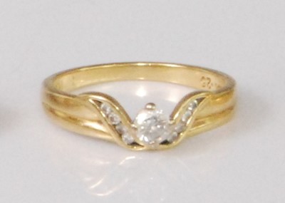 Lot 2262 - A contemporary 18ct gold diamond solitaire...