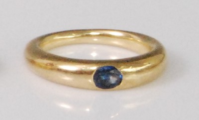 Lot 2263 - A yellow metal sapphire ring, the oval cut...
