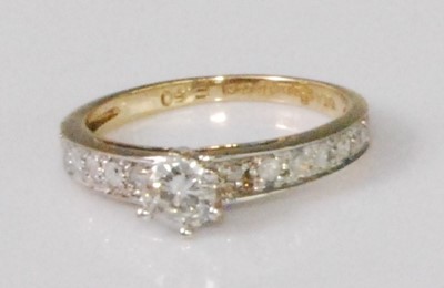 Lot 323 - A contemporary 9ct gold diamond solitaire ring,...