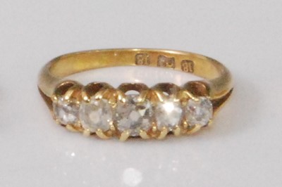 Lot 2267 - An 18ct gold diamond five stone ring, the...