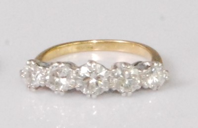Lot 2271 - An 18ct gold and platinum diamond five stone...