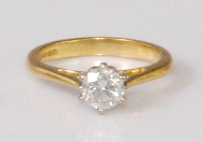 Lot 2272 - An 18ct gold diamond solitaire ring, the six...