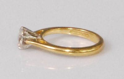 Lot 2272 - An 18ct gold diamond solitaire ring, the six...