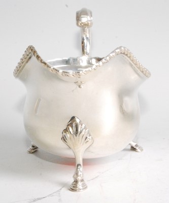 Lot 1095 - A silver sauceboat in the George III style,...