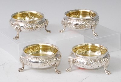 Lot 1101 - A set of four mid-Victorian silver table salts,...