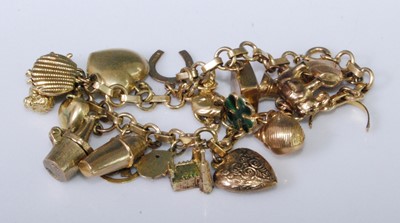 Lot 2274 - A 9ct gold charm bracelet, containing numerous...