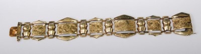 Lot 2275 - A yellow metal sectional bracelet, having leaf...