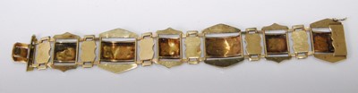 Lot 2275 - A yellow metal sectional bracelet, having leaf...