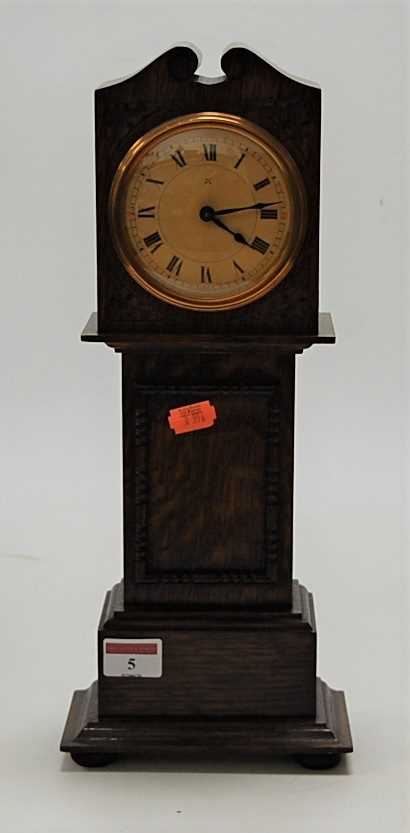 Lot 5 - A miniature moulded oak longcase clock, having...