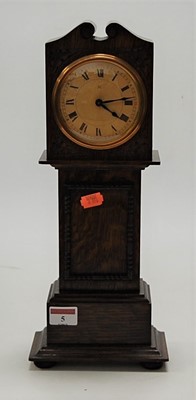 Lot 5 - A miniature moulded oak longcase clock, having...