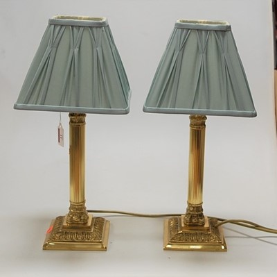 Lot 11 - A pair of reproduction lacquered brass bedside...