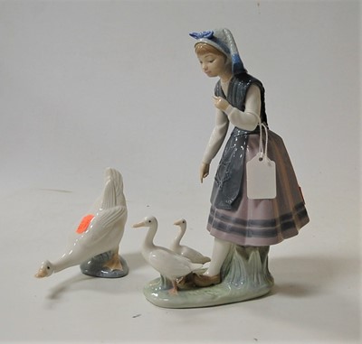 Lot 225 - A Lladro porcelain figure group of a girl with...