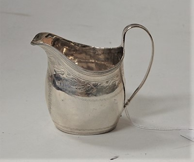 Lot 235 - A late Georgian silver and engraved cream jug,...