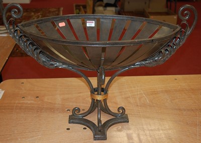 Lot 111 - A modern wrought iron twin handled planter, of...