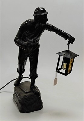 Lot 113 - A spelter table lamp in the form of a miner,...