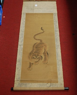 Lot 115 - A Japanese scroll watercolour depicting a tiger