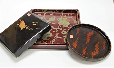 Lot 142 - A Japanese lacquered box and cover, relief...