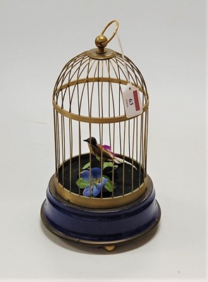 Lot 63 - A Victorian style singing bird in cage...