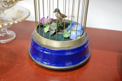 Lot 63 - A Victorian style singing bird in cage...