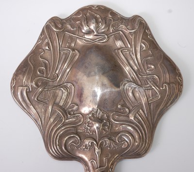 Lot 74 - An Art Nouveau silver hand-held dressing...