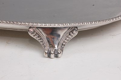 Lot 1103 - A circa 1900 silver plated twin handled tray,...