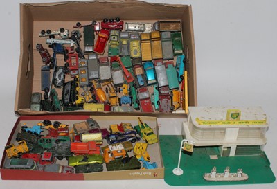 Lot 1608 - A Corgi Toys No. 54 MF50B tractor with shovel...