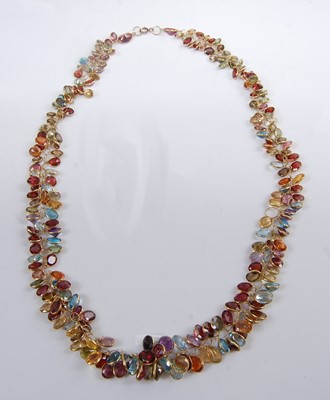 Lot 1195 - A yellow metal multi-stone fringe necklet,...