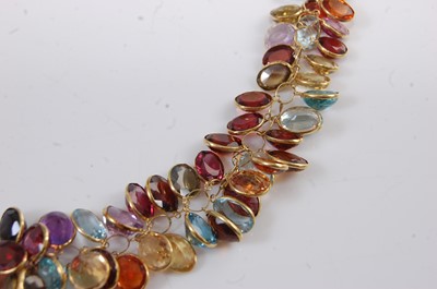 Lot 1195 - A yellow metal multi-stone fringe necklet,...