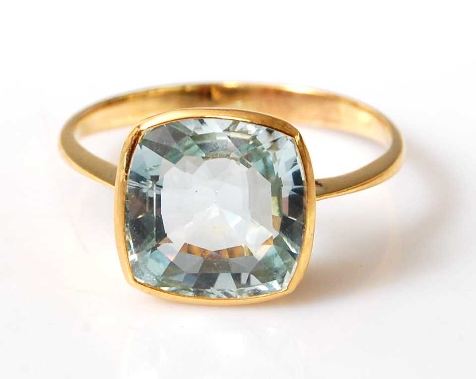 Lot 2505 - A yellow metal aquamarine single stone ring,...