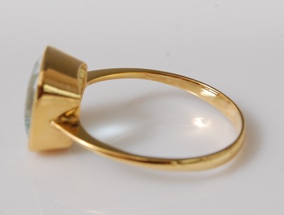 Lot 2505 - A yellow metal aquamarine single stone ring,...