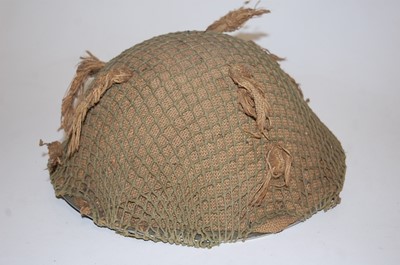 Lot 95 - A WW II steel turtle helmet