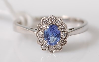 Lot 307 - An 18ct white gold, oval tanzanite, and...