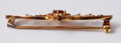 Lot 2569 - A yellow metal bar brooch, featuring a centre...