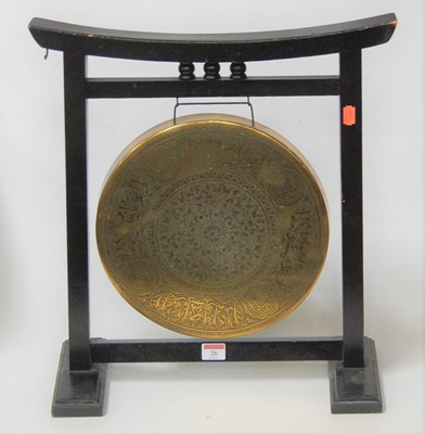 Lot 26 - An Eastern embossed brass dinner gong, within...