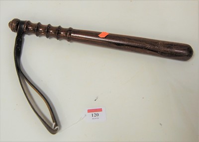 Lot 120 - A turned rosewood truncheon, having leather...