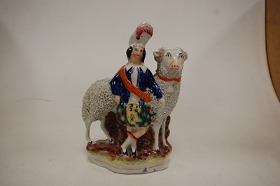 Lot 245 - A 19th century Staffordshire pottery figure of...