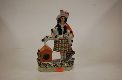 Lot 245 - A 19th century Staffordshire pottery figure of...