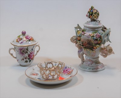 Lot 251 - A German porcelain floral encrusted cup and...