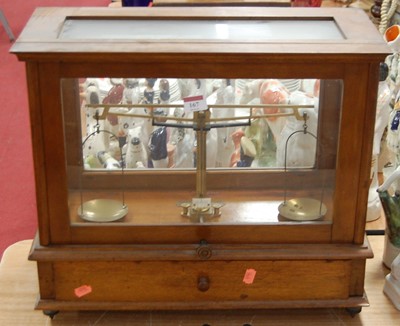Lot 167 - A set of chemist's laboratory scales in teak...