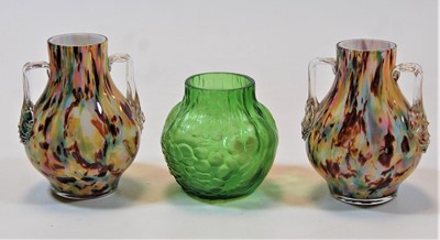 Lot 204 - A Loetz style green glass vase, of squat...